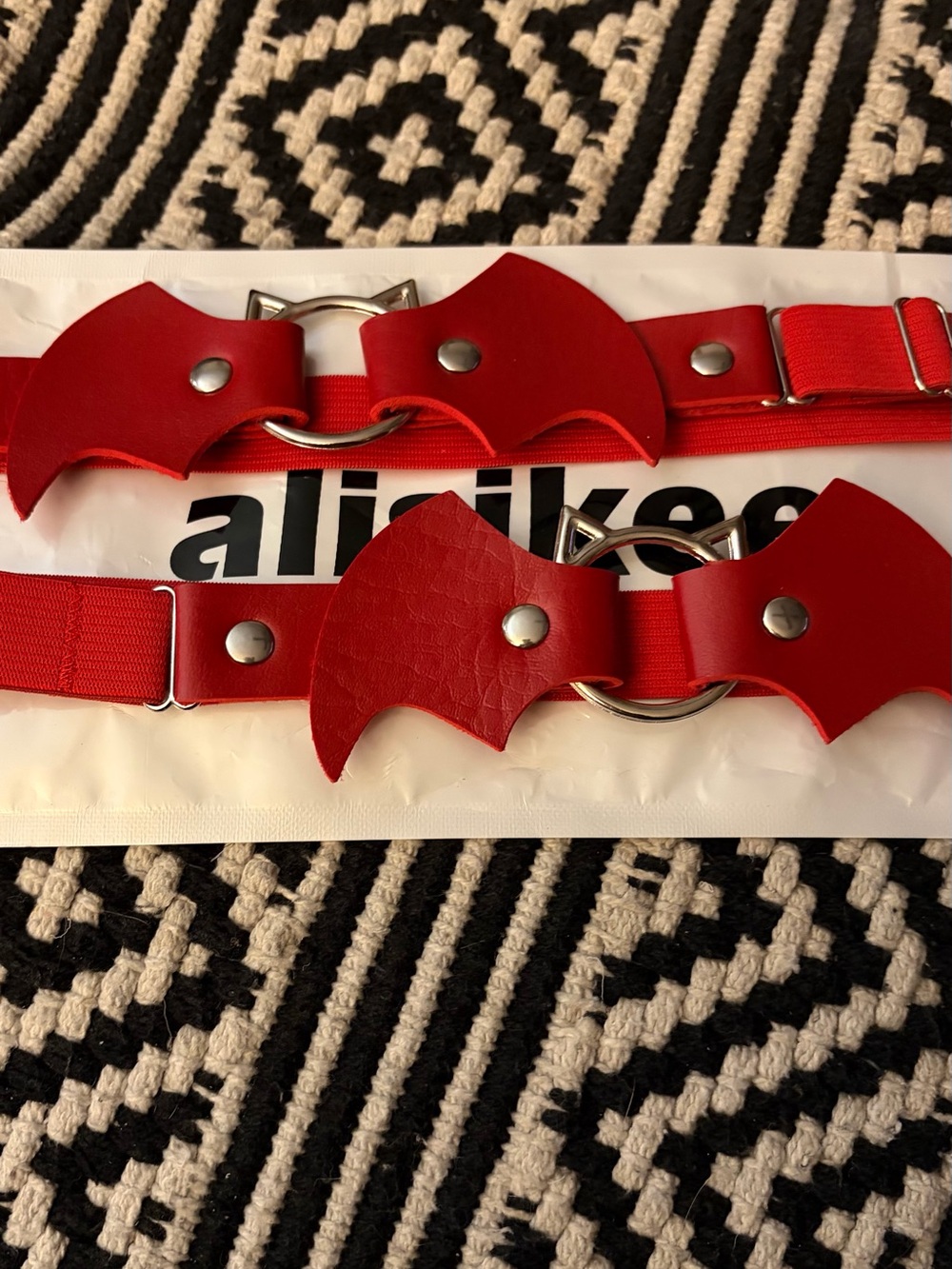 Red Leather bat leg garters. Adjustable elastic bands.